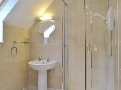 a bathroom with a sink and a shower at Lia Fail in Ballachulish