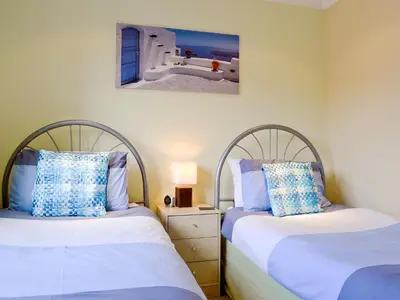 two beds sitting next to each other in a bedroom at Lia Fail in Ballachulish