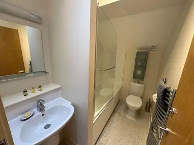a bathroom with a sink and a shower and a toilet at Apartment Thistle Lane in Edinburgh