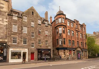 a large brick building on a city street at Castle Suite 1 Old Town in Edinburgh