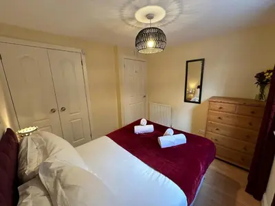 a bedroom with a bed with two pillows on it at Castle Wynd Old Town in Edinburgh