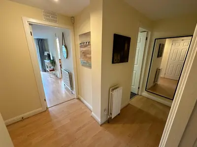 an empty hallway of a home with wooden floors at Castle Wynd Old Town in Edinburgh