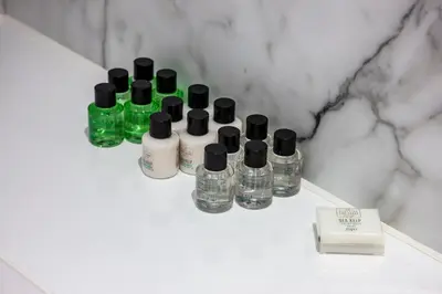 a group of bottles sitting on a counter in a bathroom at Wildwood Cottage with Hot Tub in Glencoe