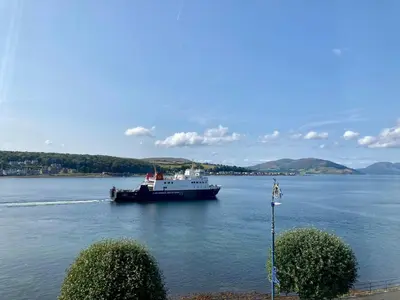 a large boat in a large body of water at Cannon House Guest House in Rothesay