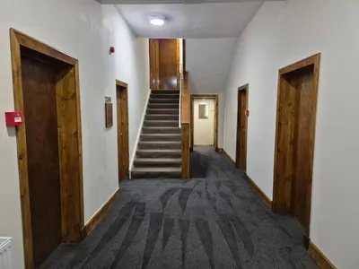 a hallway with stairs in an office building at Douglas Hotel in Glasgow