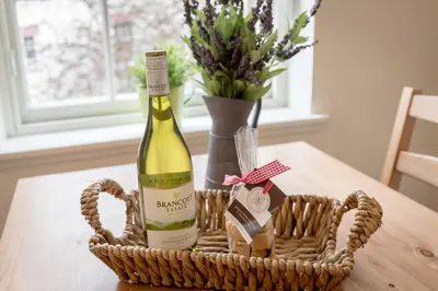 a bottle of wine in a basket on a table at The Wee Thistle in Edinburgh