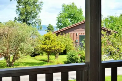 a view of a house from a window at Holy Loch Lodge in Hunters Quay