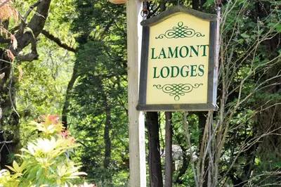 a sign for lanyon lodges on a pole at 18 Lamont Lodges in Dunoon