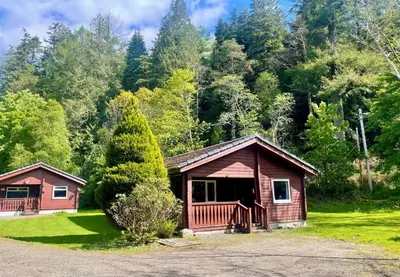 a cabin in the middle of a forest at 18 Lamont Lodges in Dunoon