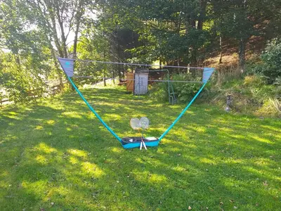 a swing set in the grass in a yard at Craignavie Cottage in Killin