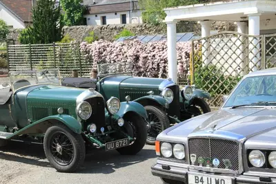 two green cars parked next to each other at Annandale Arms Hotel in Moffat