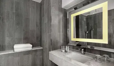 a bathroom with a sink and a mirror at DoubleTree by Hilton Edinburgh - Queensferry Crossing in North Queensferry