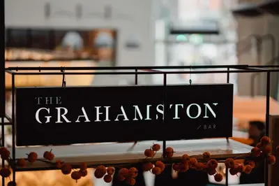 a black sign that reads the granniton on a shelf at Radisson Blu Hotel, Glasgow in Glasgow