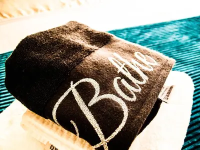 a black hat with a heart written on it at King Court Apartment in Motherwell
