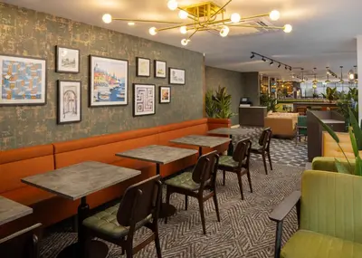 a restaurant dining room with tables and chairs at Four Points by Sheraton Edinburgh in Edinburgh