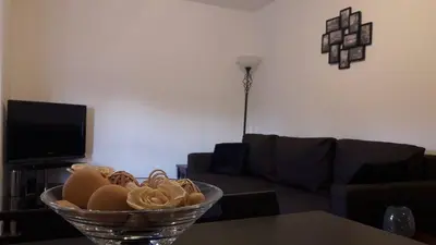 a bowl of food on a table in a living room at Sunnyside Apartments in Coatbridge