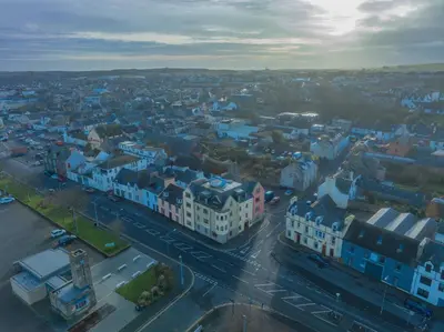 an aerial view of a city with blue buildings at Quay Head View Aparthotel in Stranraer
