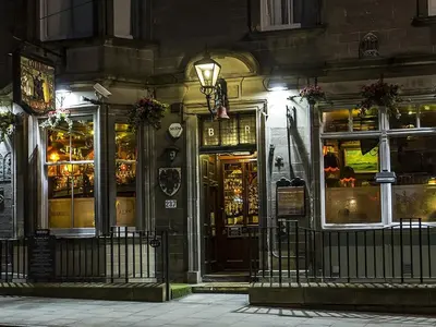 a store front of a building at night at The Lane Hotel in Edinburgh