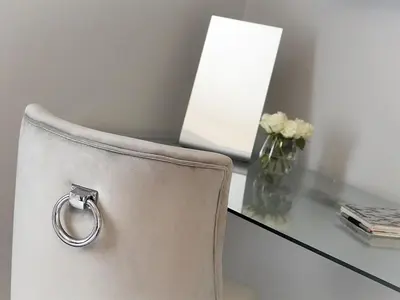 a white chair with a desk with a vase of flowers at The Lane Hotel in Edinburgh