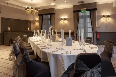 a conference room with a long table with white table cloth at Holiday Inn - Glasgow - City Ctr Theatreland by IHG in Glasgow