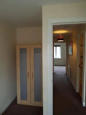 an empty hallway with wooden cabinets in a room at Livingston 4 bedroom townhouse in Livingston