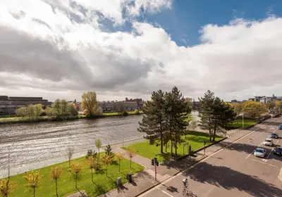 a view of a river in a city at The Metropole Residence in Glasgow