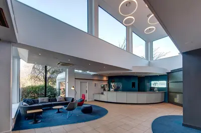 an open living room with a large glass ceiling at Holiday Inn Express Edinburgh City West by IHG in Edinburgh