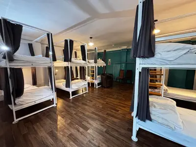 a group of bunk beds in a room at Safestay Glasgow Charing Cross in Glasgow