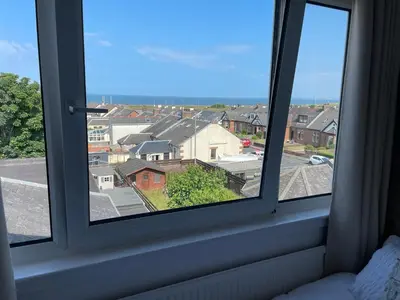 a window with a view of a city at Beechwood Ensuite Guest House in Ayr