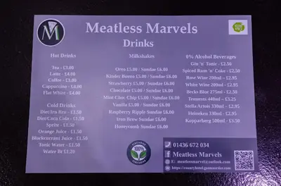a sign for a menu of measles murphys drinks at The County Hotel in Helensburgh