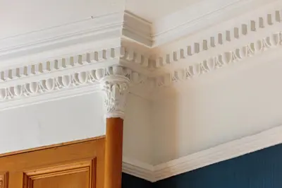 a coffered ceiling in a room with a pillar at South Learmonth Gardens Apartment in Edinburgh