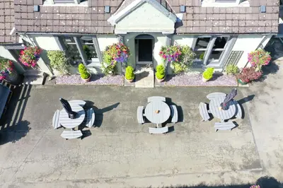 an overhead view of a patio with chairs and flowers at Auld Mill House Hotel in Dunfermline