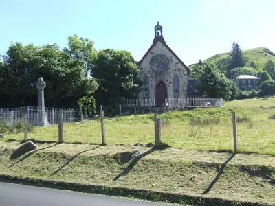 an old church with a clock on the front of it at Garbhein Bed & Breakfast in Kilmelford