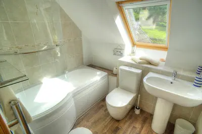 a small bathroom with a toilet and a sink at ArdFyne on Lochfyne in Strachur
