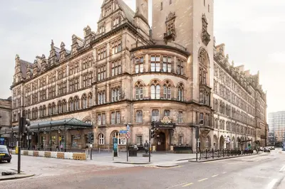 a large building on the corner of a street at voco Grand Central Glasgow by IHG in Glasgow