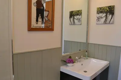 a bathroom with a sink and a mirror at The Steading at Barmore in Tarbert