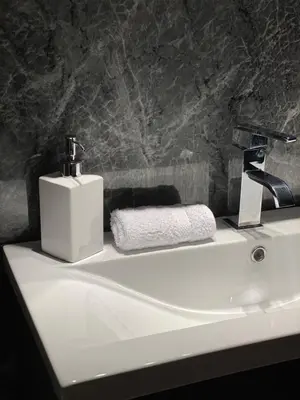 a bathroom sink with a soap dispenser on it at Georgian House in Edinburgh