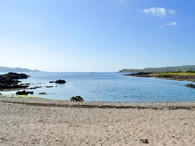 a beach with a large body of water at Thornbank in Millport