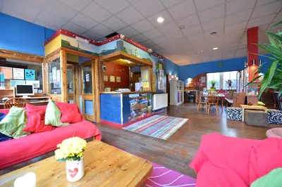 a living room with a couch and a table at Oban Backpackers in Oban