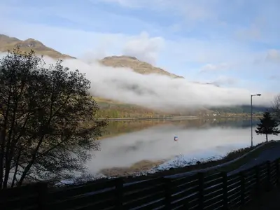 a view of a lake with clouds in the water at 16 Admiralty in Arrochar