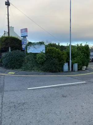 a street with a sign on the side of the road at Sea Hollies in Aberdour
