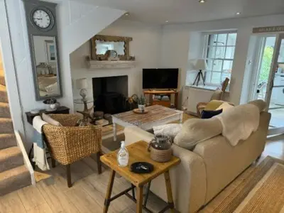 a living room with a couch and a table at Sea Hollies in Aberdour