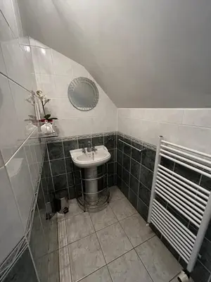 a bathroom with a sink and a mirror at Acer Lodge Guest House in Edinburgh