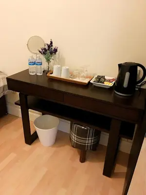 a table with a tray of drinks and a mirror at Acer Lodge Guest House in Edinburgh
