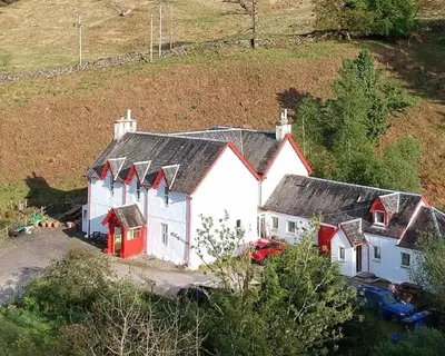 an aerial view of a white and red house at Inverardran House in Crianlarich