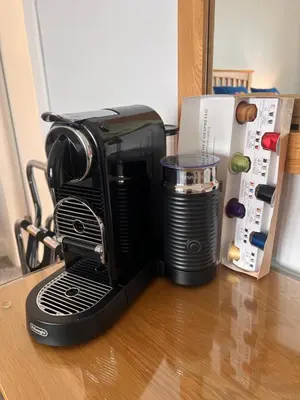 a coffee maker sitting on a table next to a refrigerator at Ronebhal Guest House in Oban