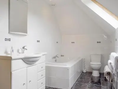 a white bathroom with a sink and a toilet at The Stables - Uk5532 in Kepculloch