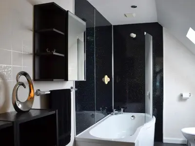 a bathroom with a bath tub and a sink at River Mill House in Ballachulish