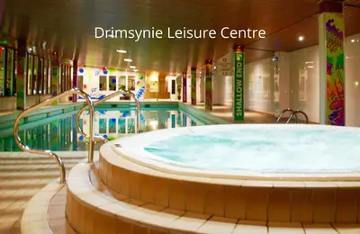 a large tub in a building with a swimming pool at Feorline Cottage in Lochgoilhead