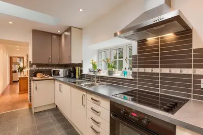 a kitchen with a sink and a stove at Dundas Flat, 1 bedroom, Comrie in Comrie